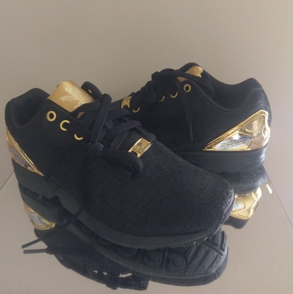 zx flux torsion black and gold